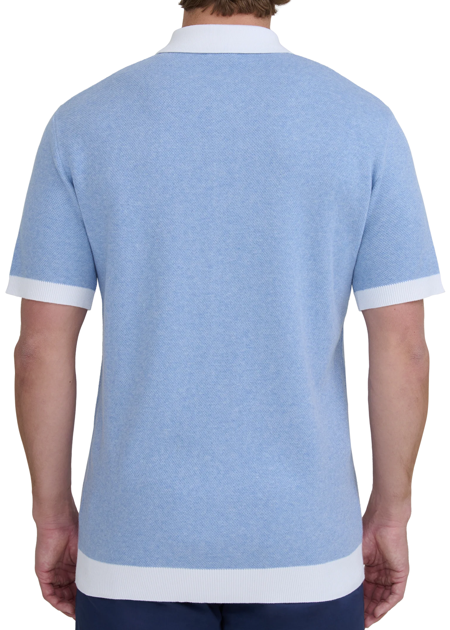 Man wearing a light blue polo shirt with white trim on a white background